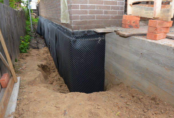 Happy homeowners after waterproofing job in Woodstock